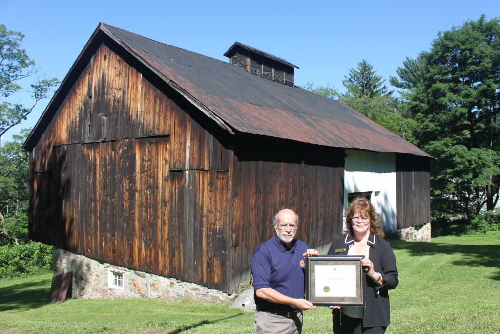 Image of The Evergreen Heritage Center receiving an award in 2015.