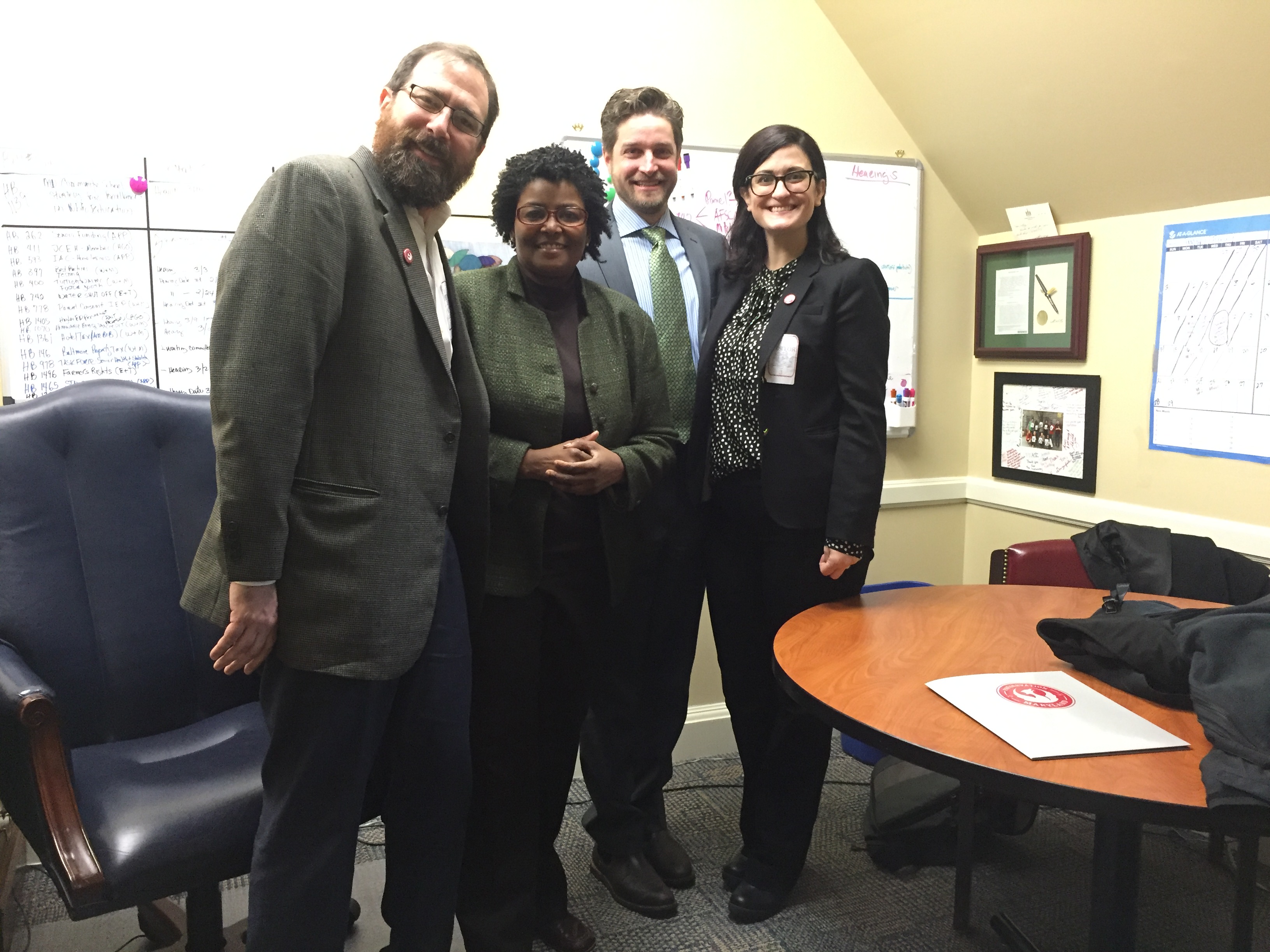 Baltimore City Delegate, Dr. Mary L. Washington (center), with Gregory Katz, Council for Maryland Archaeology and Anthony Azola and Elly Colmers of Preservation Maryland.