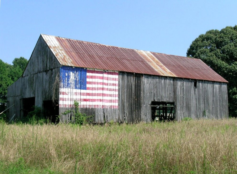 historic barn with American flag painted on the exterior 