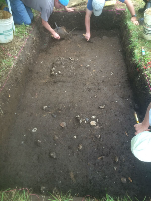 Excavating the refuse midden at River Farm.