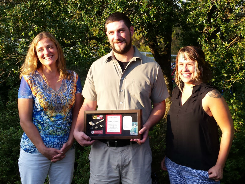 Matt Nickelson receives award with Stephanie Sperling and Mandi Melton.