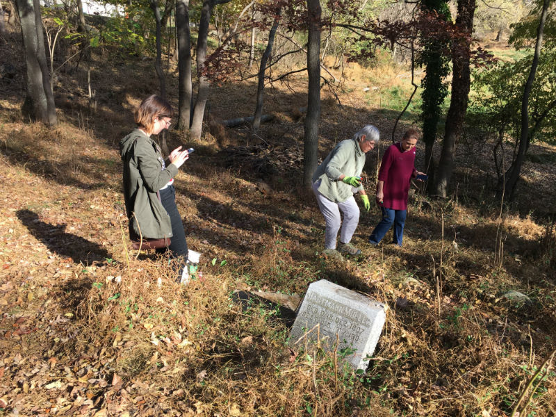 Image of Michelle using app to document stones.