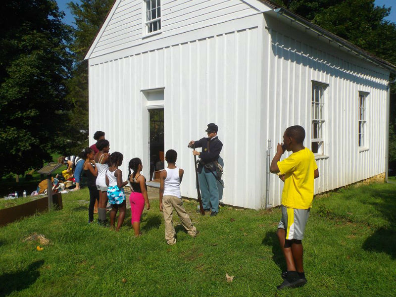 Public education demonstration at a restored Tolson's Chapel.