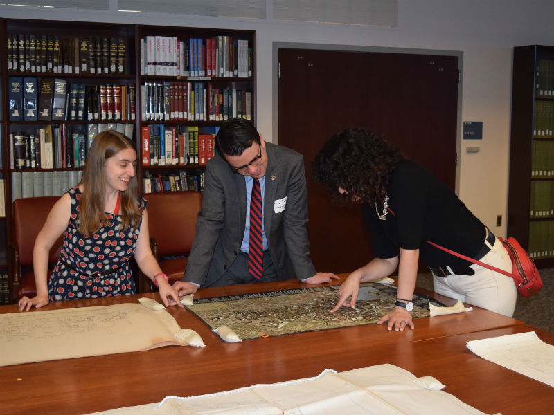 Jennifer Wachtel with an exhibit of the Preservation Maryland collection.