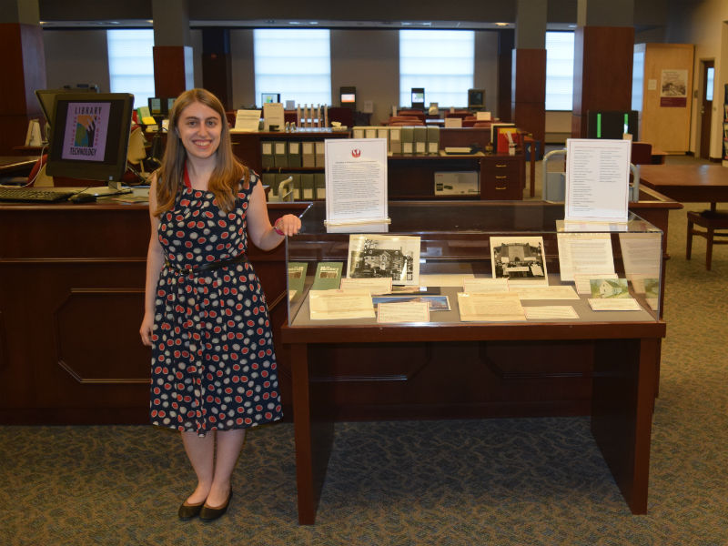 Jennifer Wachtel with an exhibit of the Preservation Maryland collection.