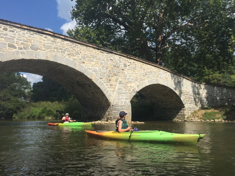 Kayaks pass under the ca. 1836 Burnside's Bridge.