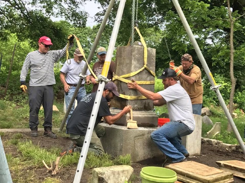 Moss Rudley working on a historic monument.