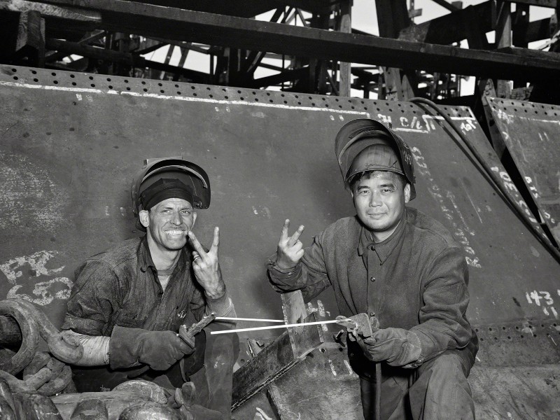 Electric welders working on the Liberty ship Frederick Douglass at the Bethlehem-Fairfield shipyards in Baltimore, MD, 1943. Photo by Roger Smith for the Office of War Information courtesy of Shorpy.