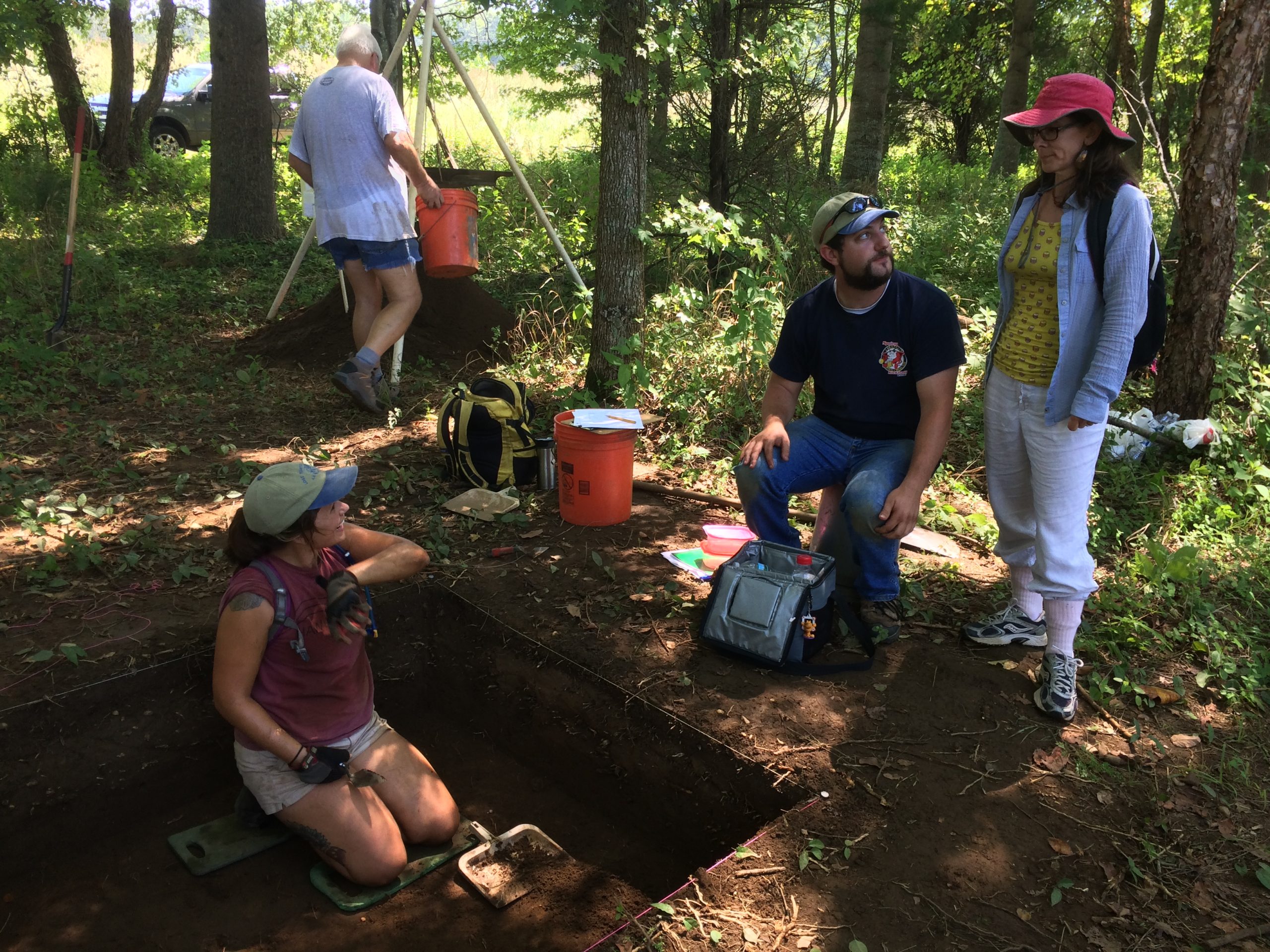 Former Interns visit an archeological dig site.