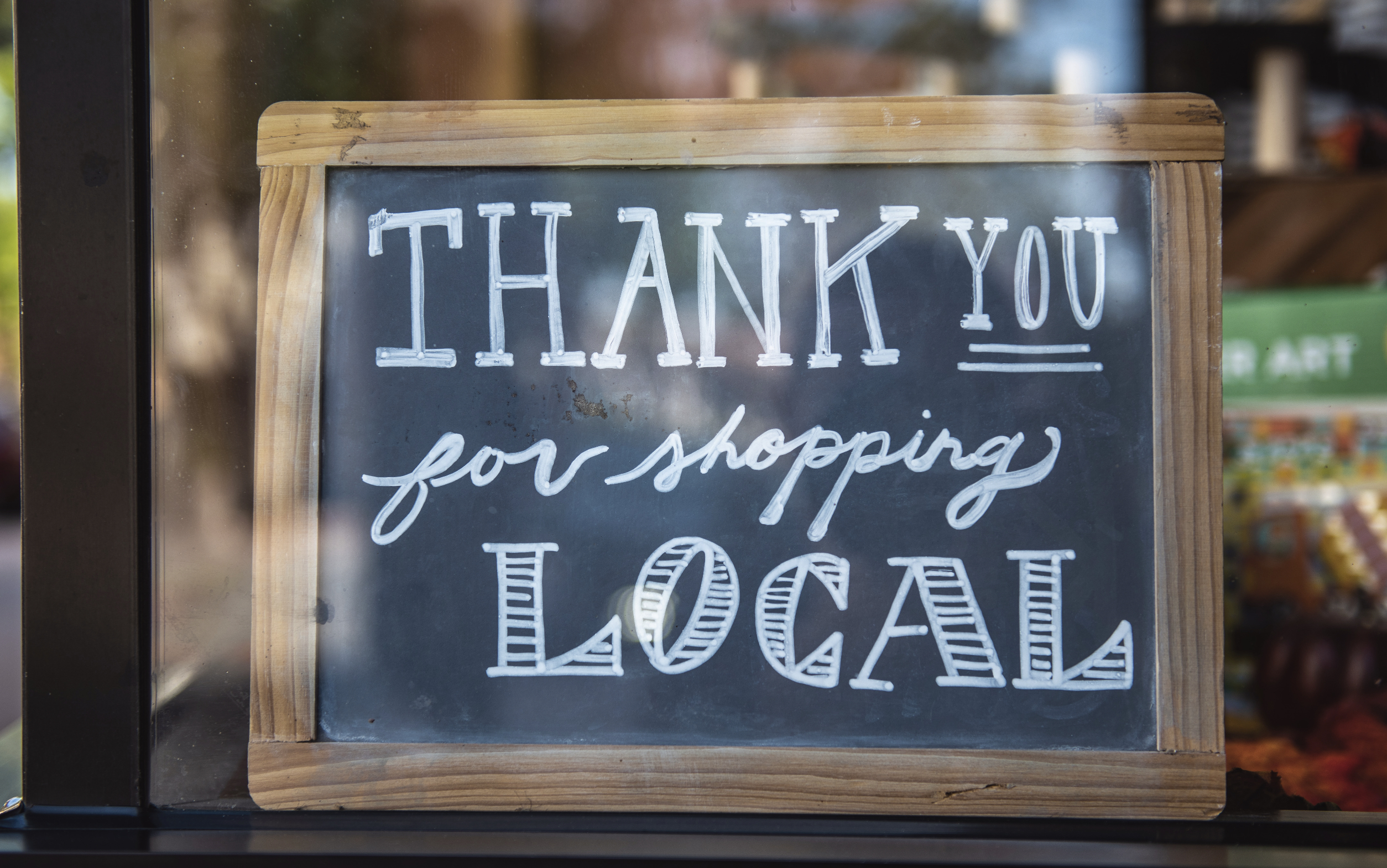 Shop Local Sign | Image via Unsplash